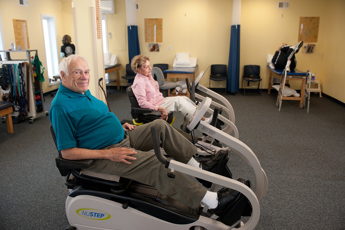 Sussex pre and post operative therapy two patients on a NUSTEP machine