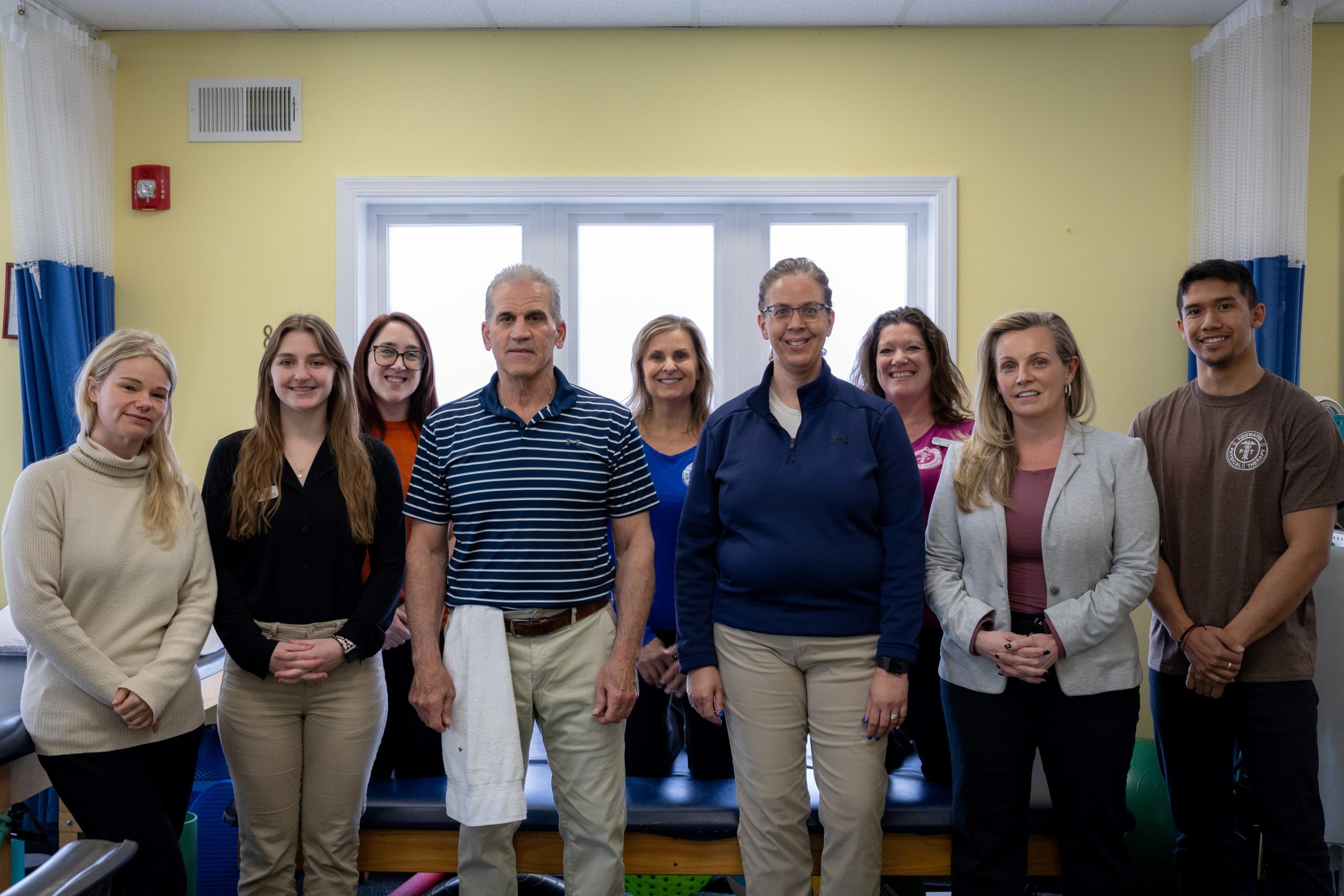 Ocean View Group Staff standing all together at the Tidewater physical therapy office